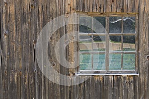 Vintage Window of old farm house barn. Wooden rustic background.