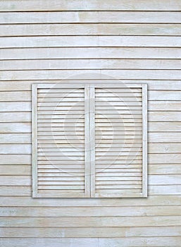 Vintage window on wooden wall.