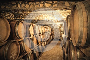 Vintage winery cellar with wine barrels