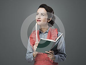 Vintage woman with cookbook photo