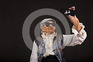 Vintage woman in glitters with smart phone