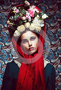 Vintage. Woman in Red Shawl and wreath of Roses. Retro photo