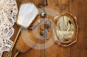 Vintage woman toilet objects next to old photography