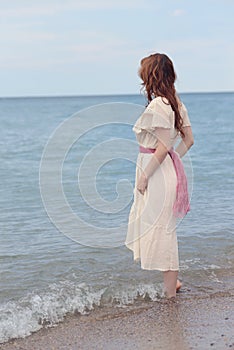 Vintage woman wadding in the sea