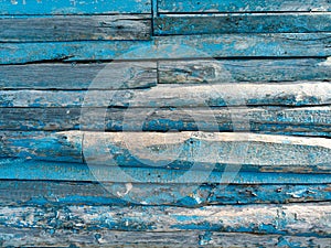 Vintage wood background with peeling blue paint