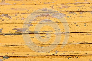 Vintage wood background with peeling yellow paint