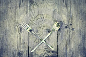 Vintage wood background with silver cutlery