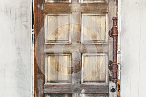 Vintage wood door with rust metal handle background texture