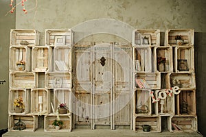 Vintage wood shelf with books cage dry flowers