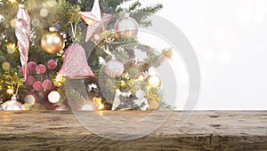 Vintage wood table top in front of blurred Christmas tree