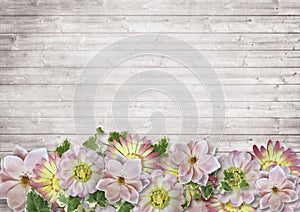 Vintage wooden background with a border of delicate flowers