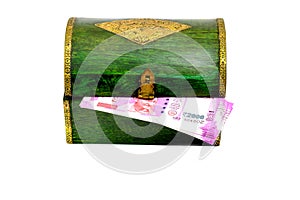 Vintage wooden casket from India with rupees notes