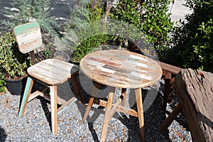 Vintage wooden Chairs on backyard tropical garden