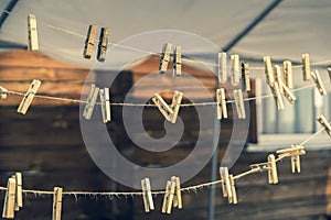 Vintage wooden clothespins on a natural rope