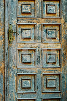 Vintage wooden door and old white wall as background