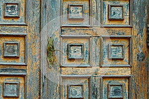 Vintage wooden door and old white wall as background