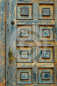 Vintage wooden door and old white wall as background