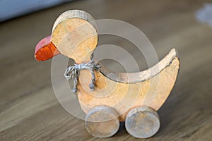 Vintage wooden duck toy on wheels