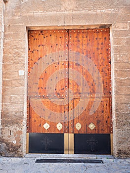 Vintage wooden gate door in the old building of the historic old town
