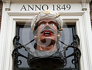 Vintage wooden head called Gaper, dutch symbol for a drugstore