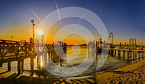 Vintage wooden pier at beach sunset, Lido di Jesolo