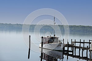 Vintage wooden powerboat at the dock