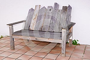 Vintage wooden recycled palets make wood bench in house terrace photo