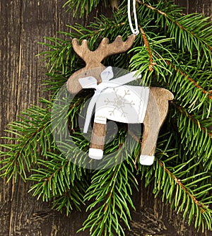 Vintage Wooden Reindeer Christmas Decoration and Fir Tree Branch