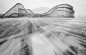 Vintage wooden Rollercoaster on the beach.
