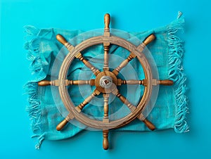 Vintage Wooden Ship Steering Wheel Isolated on Bright Blue Background with Textured Cloth Nautical Maritime Decor Concept