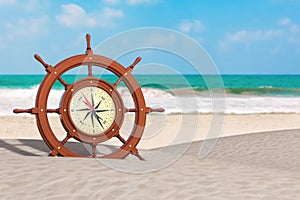 Vintage Wooden Ship Steering Wheel with Rare Compass on an Ocean Deserted Coast. 3d Rendering