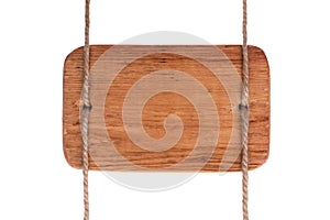 Vintage wooden signboard of light wood, hanging on ropes. Isolated