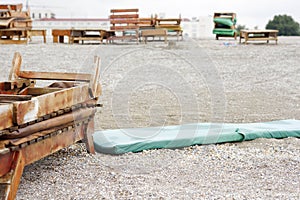 Vintage wooden sun lounger on the beach