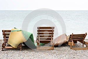 Vintage wooden sun lounger on the beach