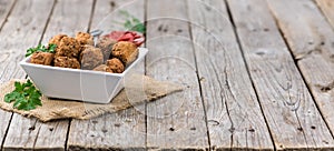 Vintage wooden table with Meatballs selective focus; close-up s