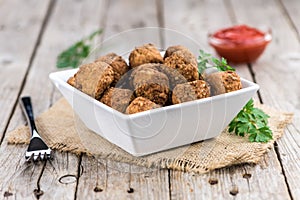 Vintage wooden table with Meatballs selective focus; close-up s