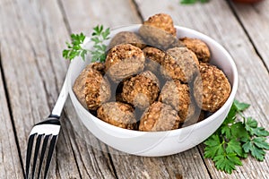 Vintage wooden table with Meatballs selective focus; close-up s