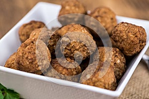 Vintage wooden table with Meatballs selective focus; close-up s