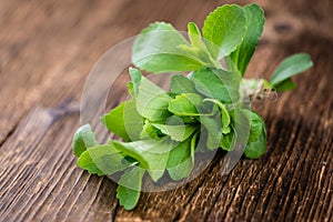 Vintage wooden table with Stevia leaves