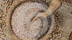 Vintage wooden table with Wheat Bran selective focus; close-up shot