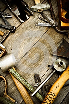 Vintage working tools on wooden background