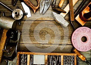 Vintage working tools on wooden background