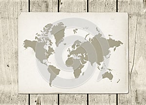 Vintage world map parchment on a wooden wall