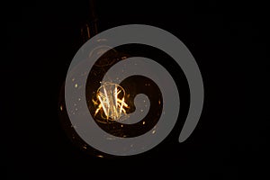 Antiguo gusano lámpara Encendiendo a negro fotografía 