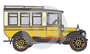 The vintage yellow and cream bus photo