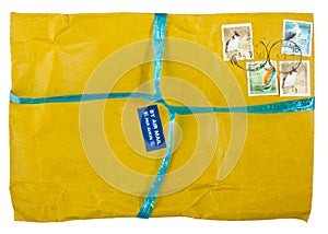 Vintage yellow envelope with stamps