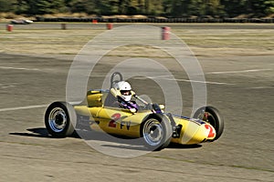 Vintage yellow racecar photo