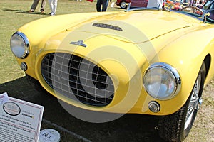 Vintage yellow sportscar front detail