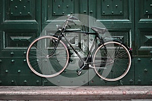 Vintaged bicycle suspended photo