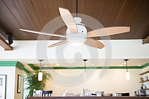 vintageinspired ceiling fan with lights in a caf photo